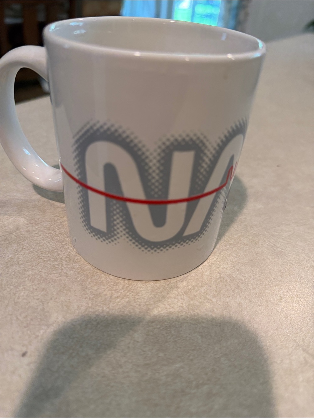 White Ceramic Coffee Mug with Gray Graphic and Red Accent